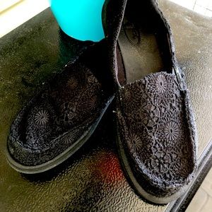 Black slip on Sanuk with crochet detail
